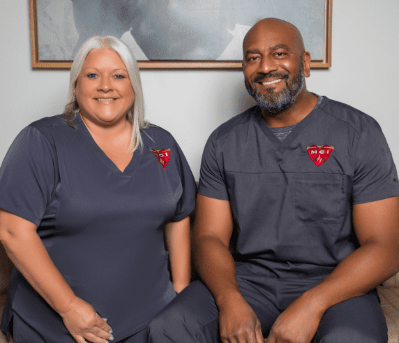 Group photo of the friendly and professional staff at Metropolitan Cardiovascular Institute, standing together in the clinic.