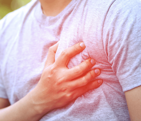Man having chest pain - heart attack outdoors.