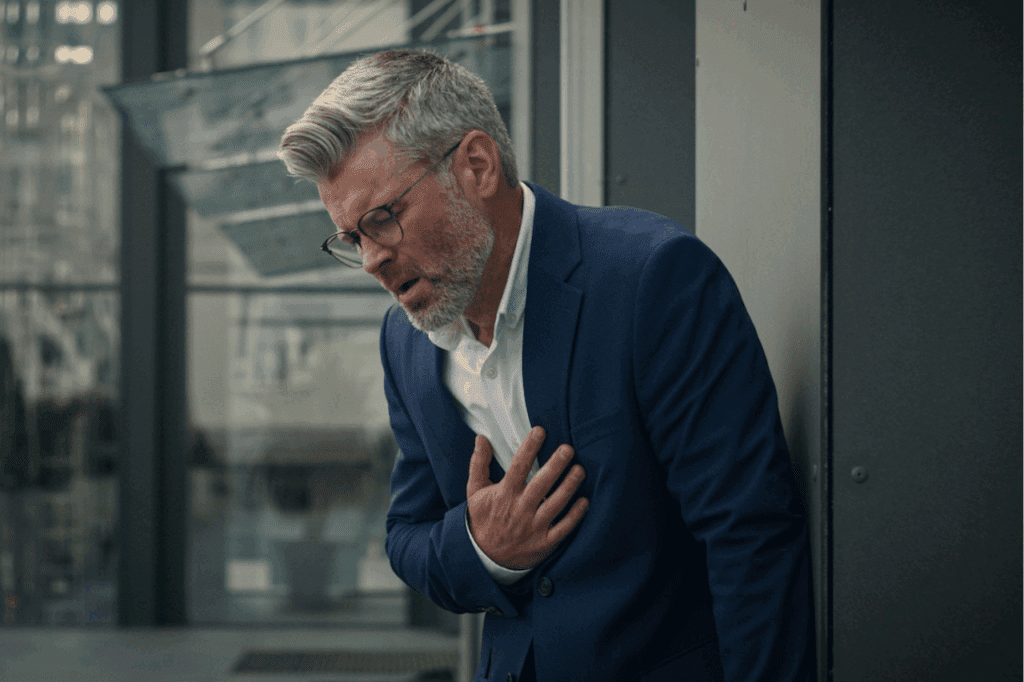 businessman chest with pain